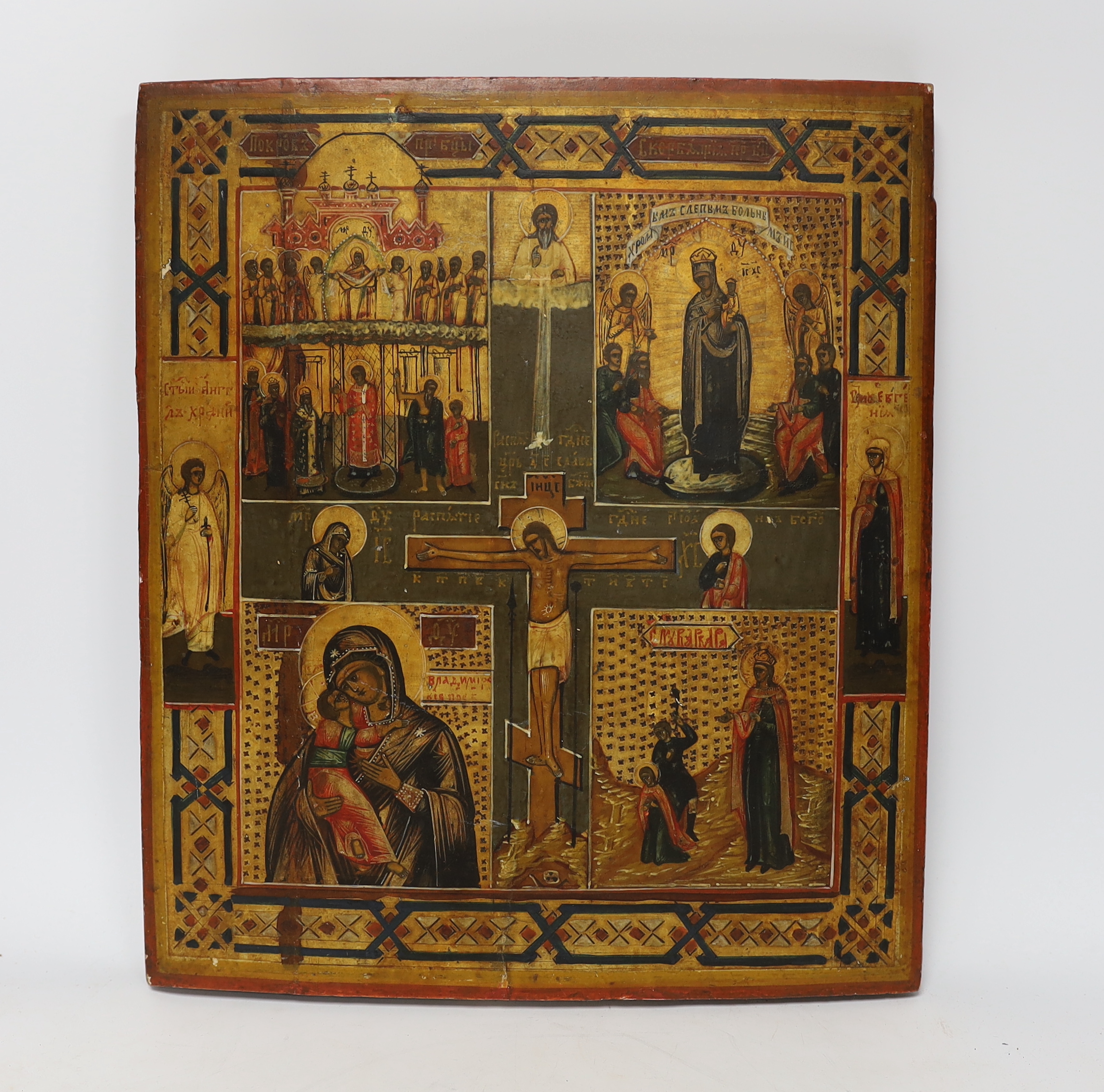 Late 19th century Russian School, hand painted icon on convex panel, indistinct ink label verso, 35 x 31cm, unframed